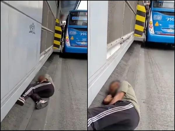 Un movimiento en falso y es una tragedia: hombre acostado en un pilar o base del MIO, cerca al carril y paso de buses
