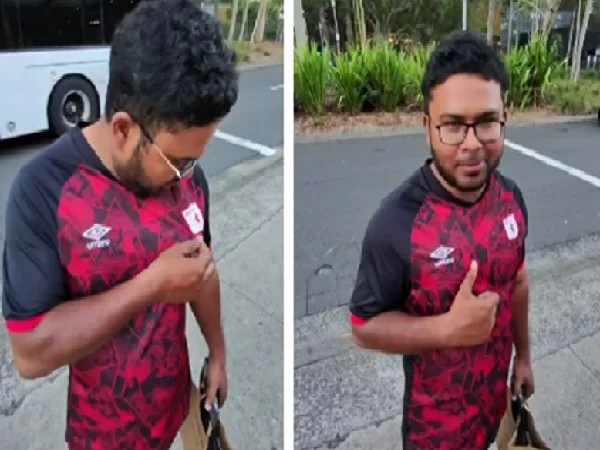 Asiático con camiseta del América de Cali.