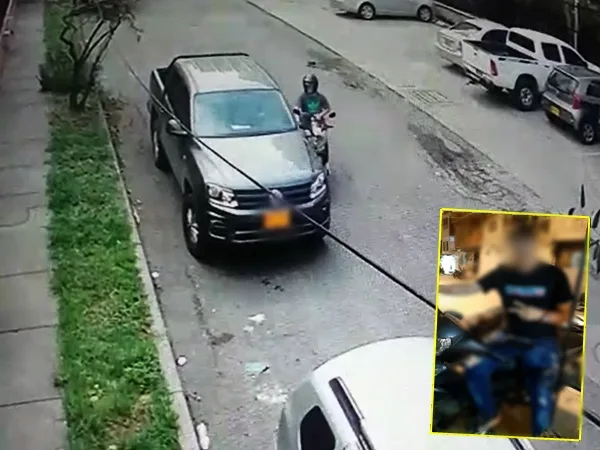 En Cali: video revela que el sujeto de la moto, si iría a robar al conductor de la camioneta