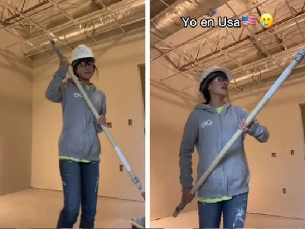 Latina pintando casas en Estados Unidos.