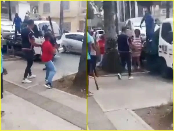 Varias personas intentaron bajar de la grúa a la fuerza un carro que fue inmovilizado por agentes de tránsito en una calle del barrio Versalles en Cali